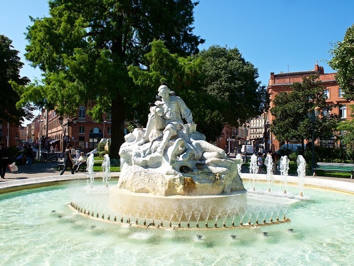 Toulouse, France-08 19 2015:The fountain in Wilson Square shows the poet P.Godolin, in the city of Toulouse, France.Toulouse is the capital of the department of Haute-Garonne.